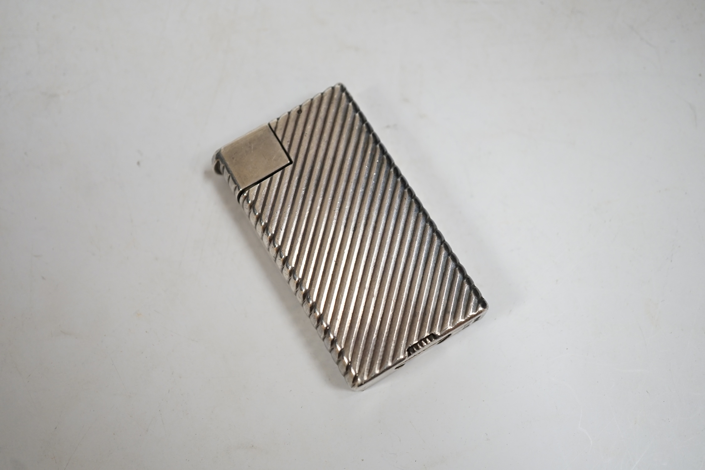 A Dunhill Rollagas lighter, 5.5cm high. Condition - fair, not working
